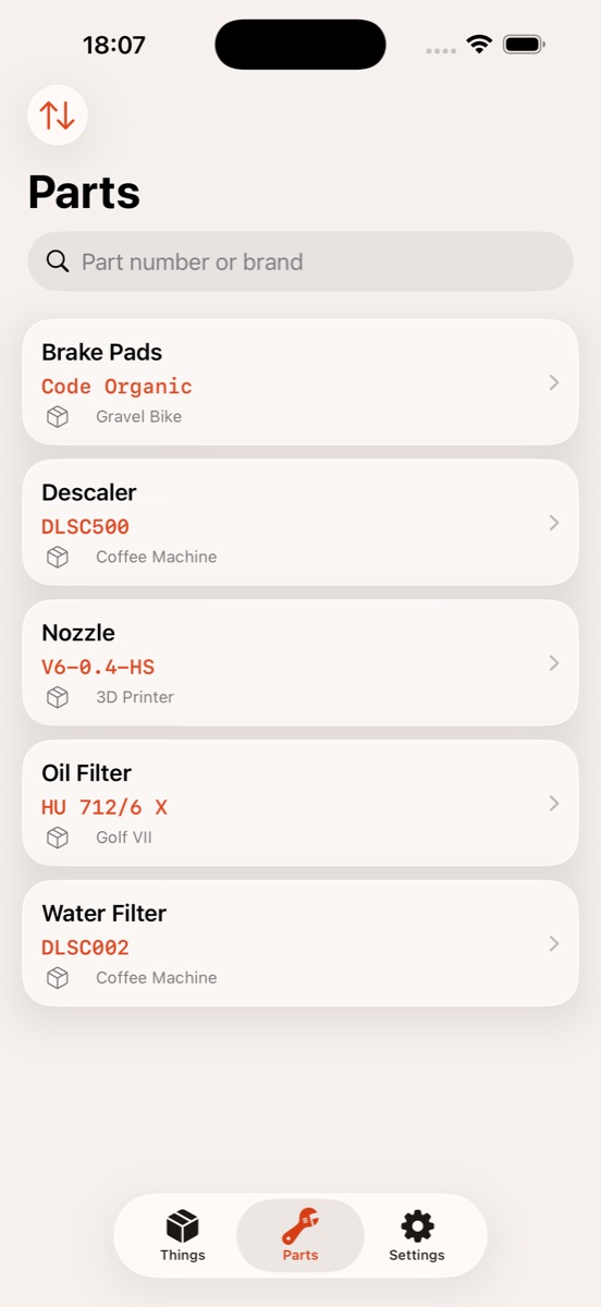 The Parts tab listing brake pads, descaler, nozzle, oil filter and water filter with their part numbers and owning things.